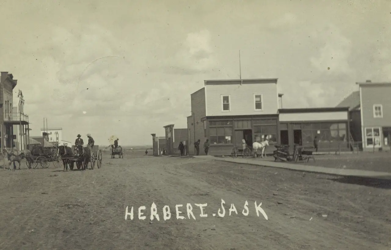 Street scene in Herbert with horse-drawn wagons, about 1911