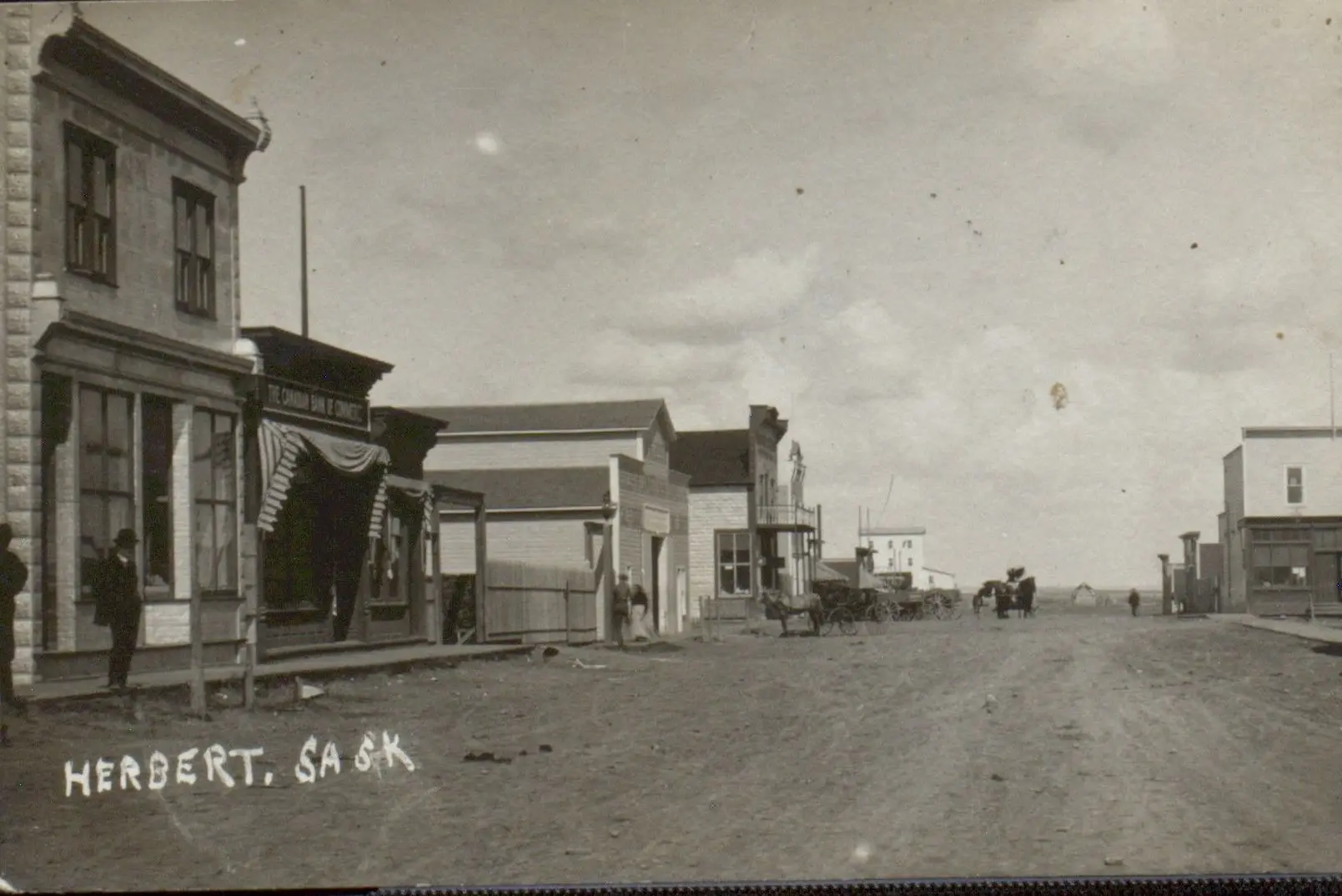 Street scene in Herbert with storefronts and wagons